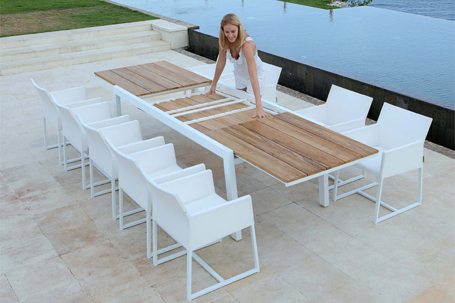 Baia Teak Aluminum Extendable Dining Table by Mamagreen, showing baia teak aluminum extendable dining table with mono dining chair in live shot.