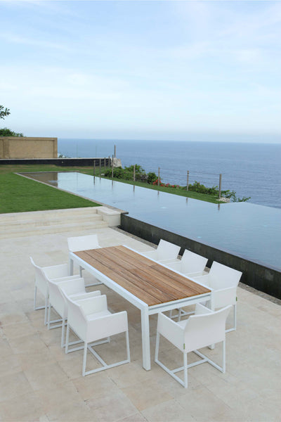 Baia Teak Aluminum Extendable Dining Table by Mamagreen, showing baia teak aluminum extendable dining table with mono dining chair in live shot.