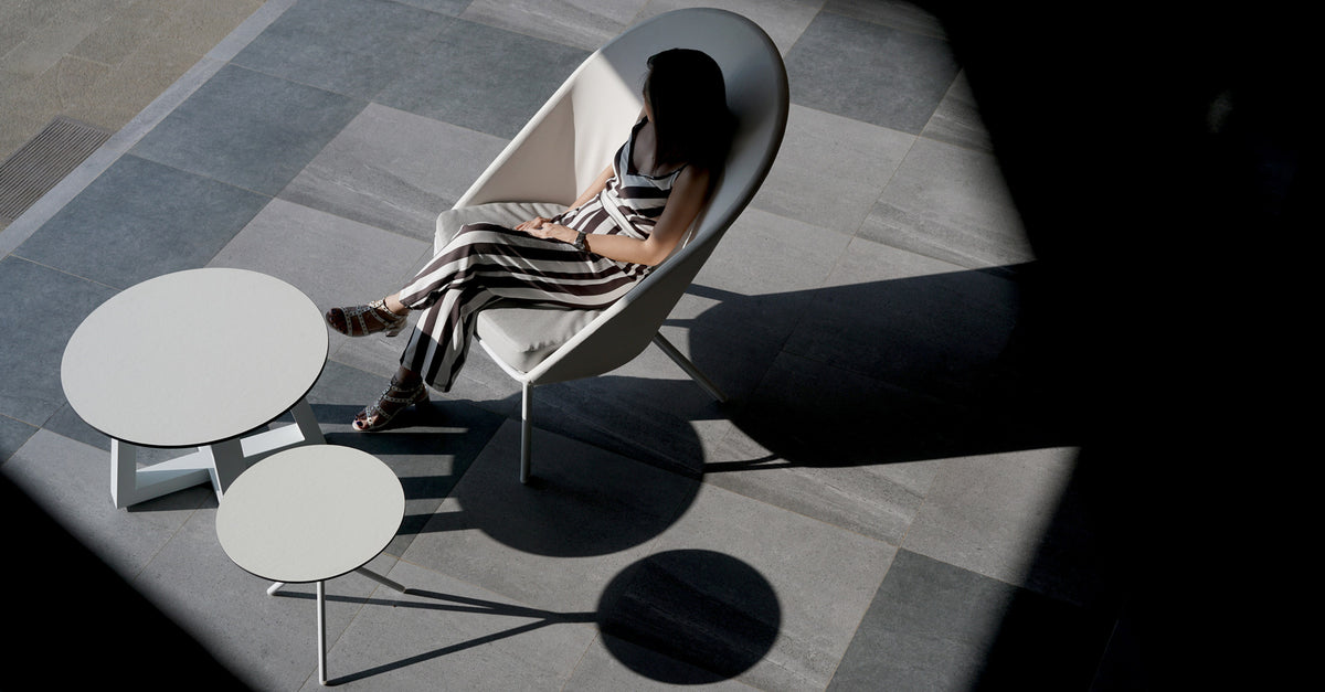 Bono HPL Aluminum Side Table by Mamagreen, showing bono hpl aluminum side table with zupy high back chair and mono lounge table in live shot.