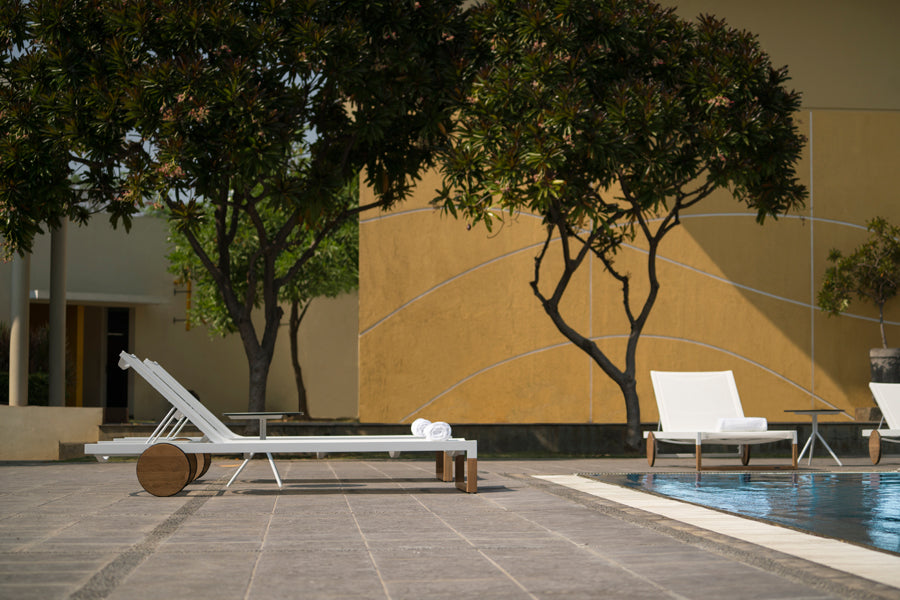 Ekka Lounger by Mamagreen, showing ekka lounger with bono hpl side table in live shot.