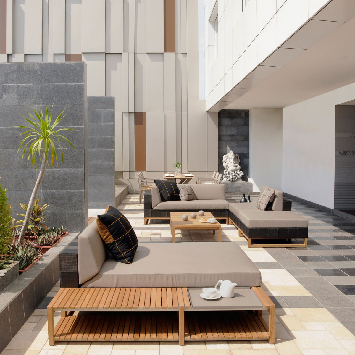 Ekka Sectional Chaise by Mamagreen, showing ekka sectional chaise with ekka sectional seat and coffee table in live shot.