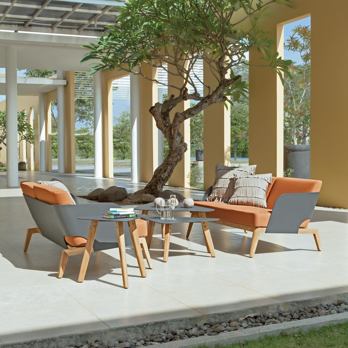 Kaat Teak 2-Seater Sofa by Mamagreen, showing kaat teak 2-seater sofa with large and medium coffee table in live shot.
