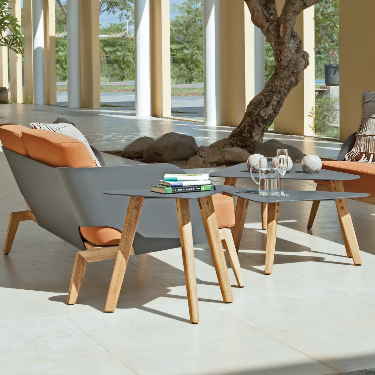 Kaat Teak Side Table by Mamagreen, showing clsoeup view of kaat teak side table with kaat teak coffee tables and kaat teak 2-seater sofa in live shot.