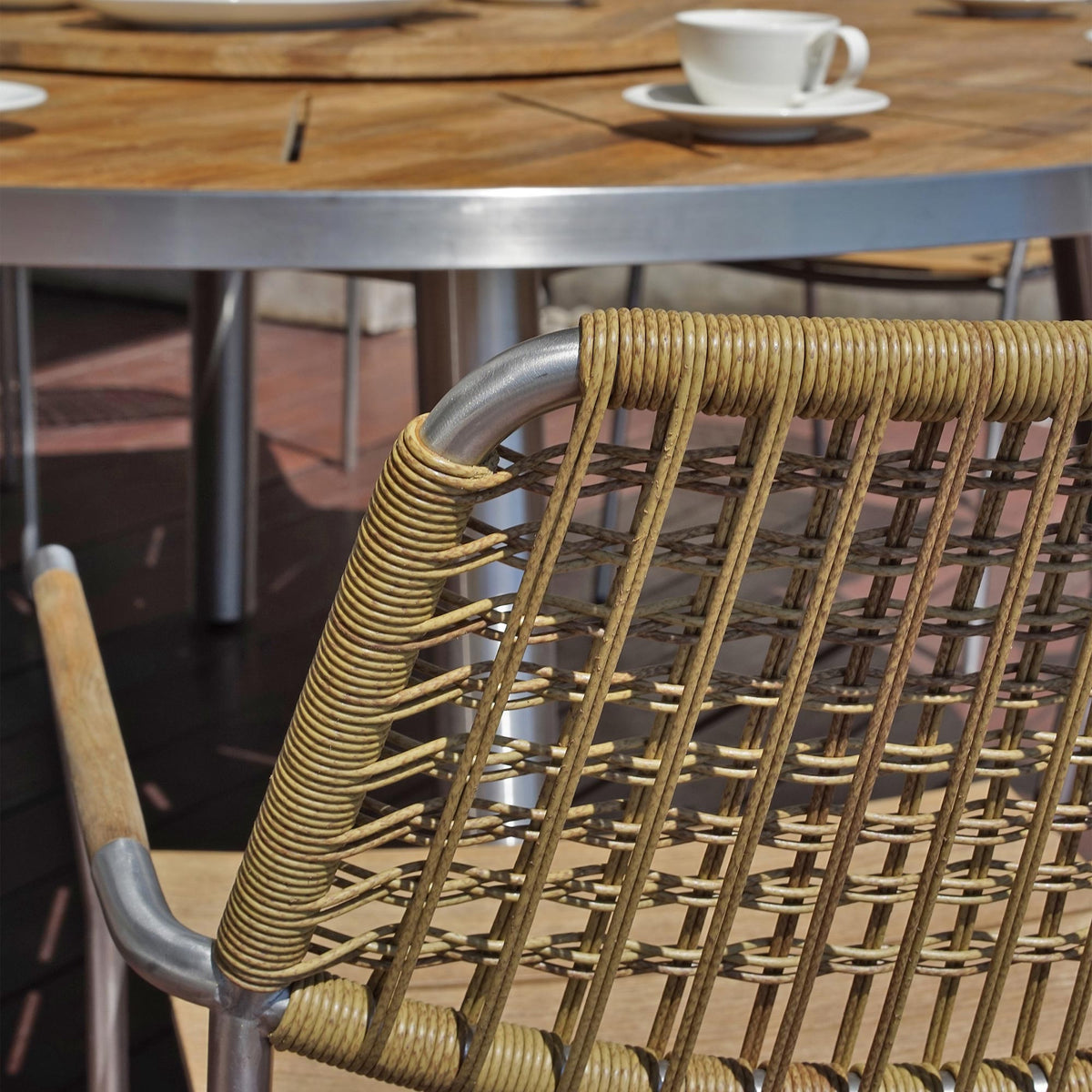 Meika Wicker Stacking Chair by Mamagreen, showing clsoeup view of meika wicker stacking chair in live shot.