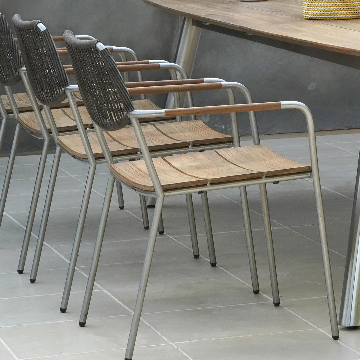 Meika Wicker Stacking Chair by Mamagreen, showing clsoeup view of meika wicker stacking chairs in live shot.