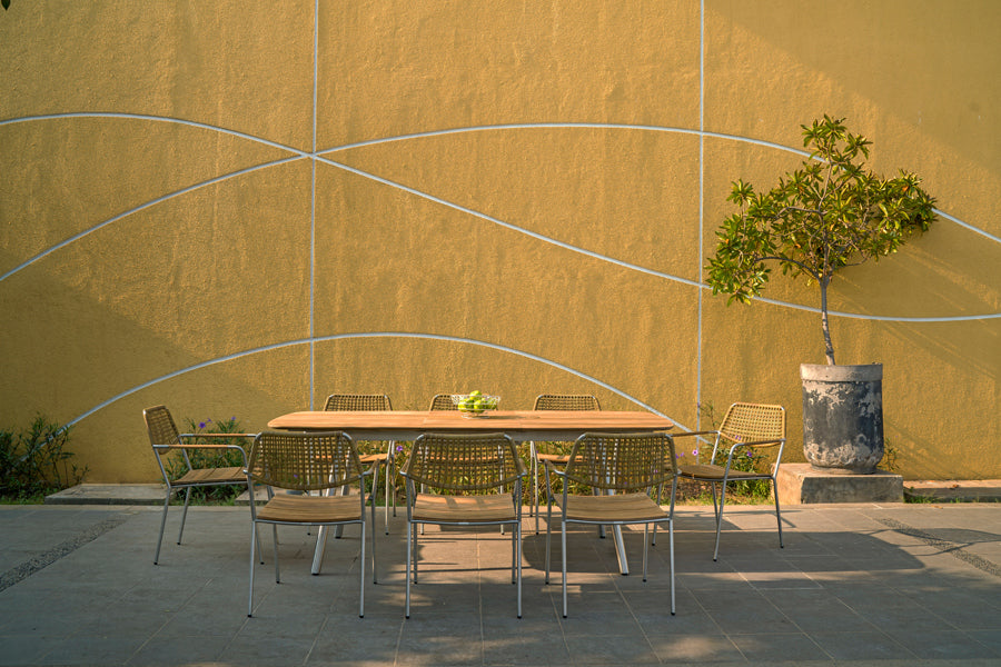 Meika Wicker Stacking Chair by Mamagreen, showing meika wicker stacking chairs in live shot.