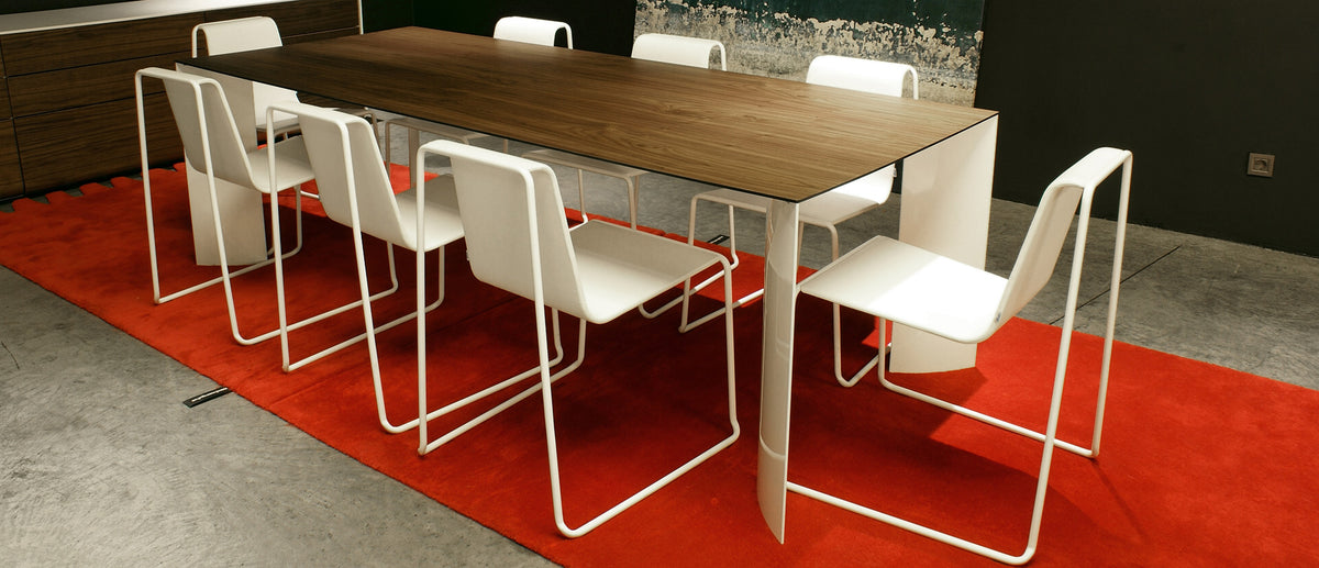 Manu Table by B&T, showing manu table with chairs in live shot.