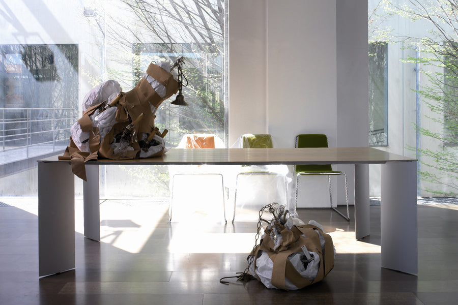 Manu Table by B&T, showing manu table with chairs in live shot.