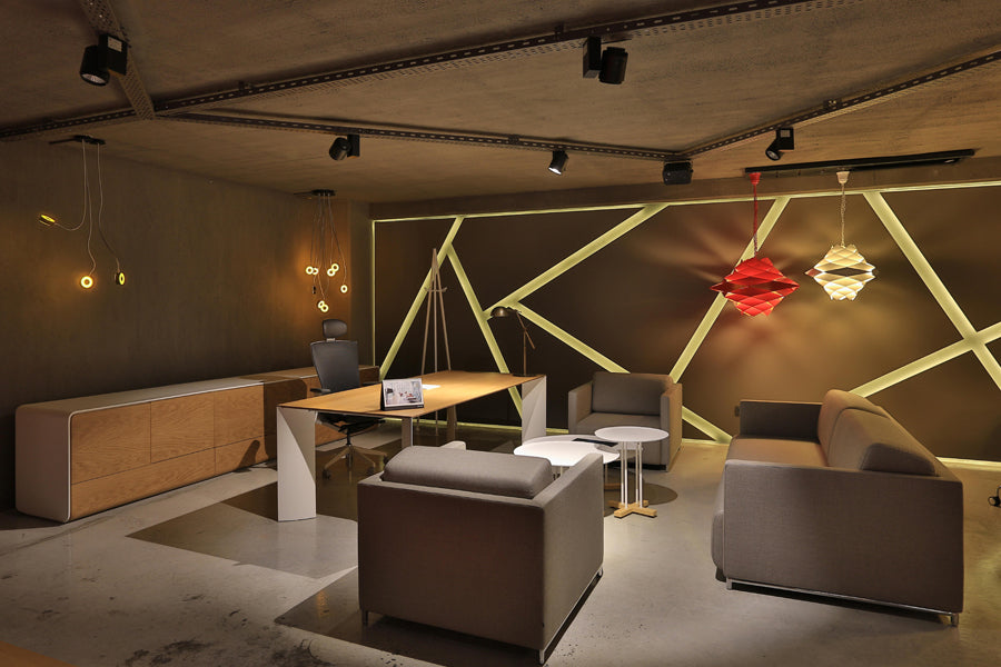 Manu Table by B&T, showing manu table with chairs & sofa in live shot.