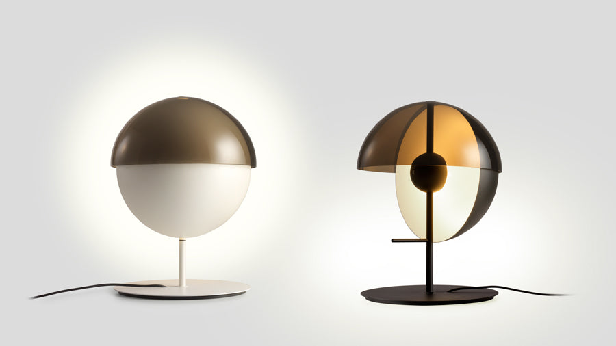 Theia Table Lamp by Marset, showing back view & angle view of white & black table lamp respectively.