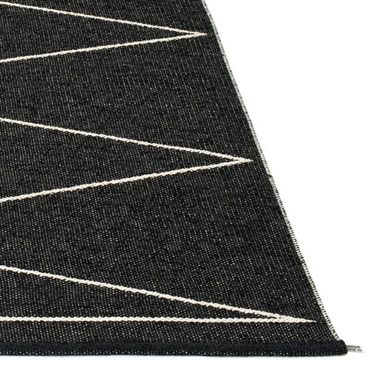 Max Black & Vanilla Runner Rug by Pappelina, showing closeup view of max black & vanilla runner rug.