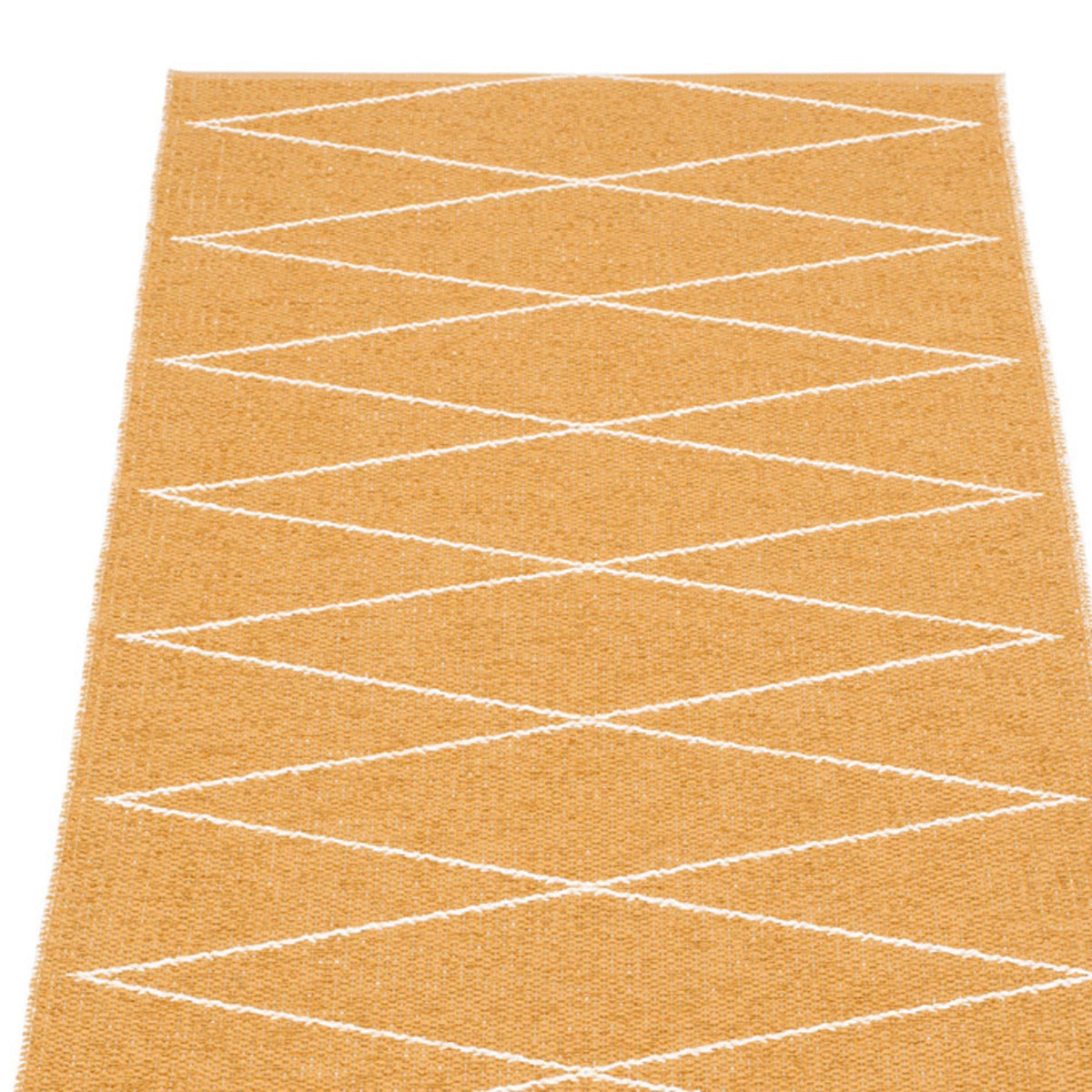 Max Ochre Runner Rug by Pappelina, showing closeup view of max ochre runner rug.