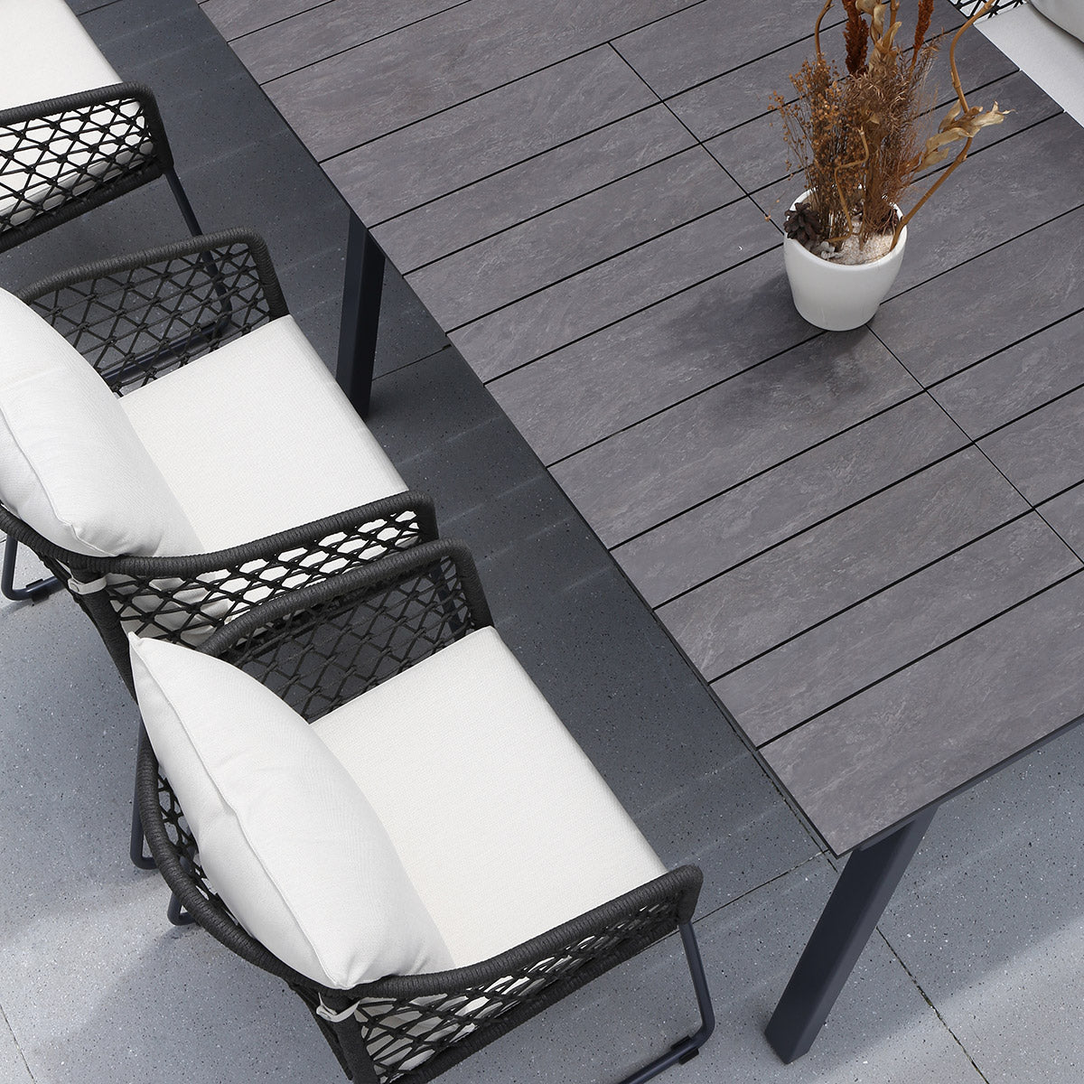 Maxximus HPL Extension Dining Table by Mamagreen, showing closeup view of maxximus hpl extension dining table in live shot.