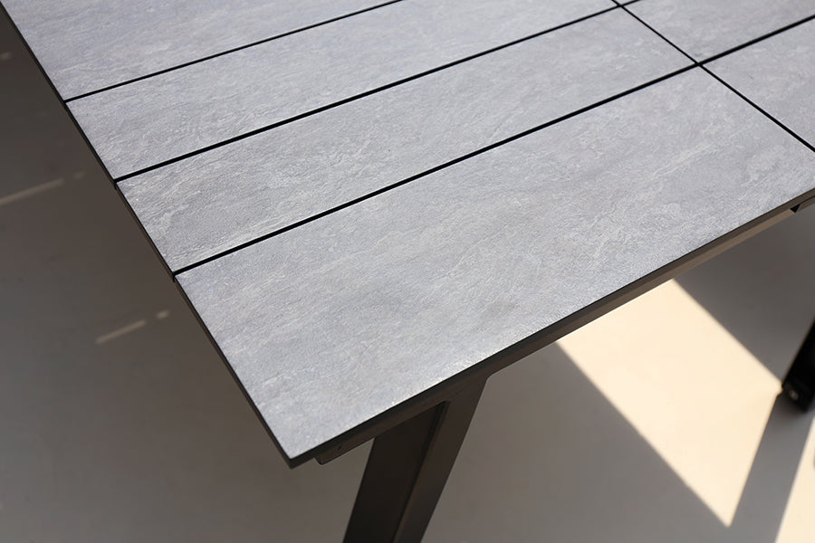 Maxximus HPL Extension Dining Table by Mamagreen, showing closeup view of maxximus hpl extension dining table in live shot.