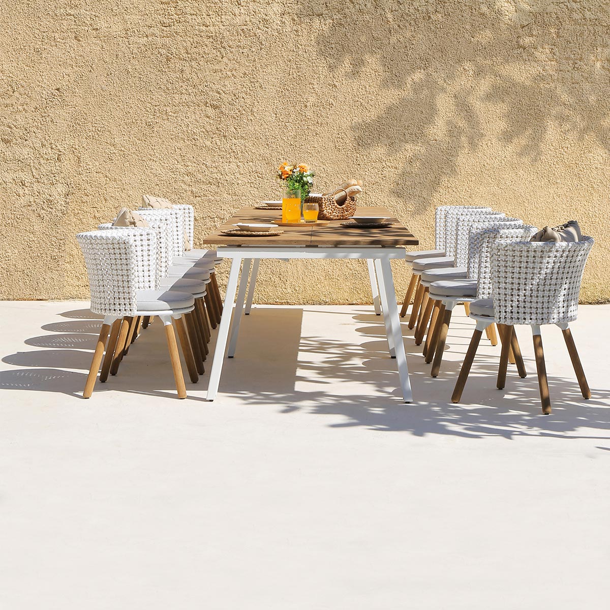 Maxximus Teak Extension Dining Table by Mamagreen, showing maxximus teak extension dining table in live shot.