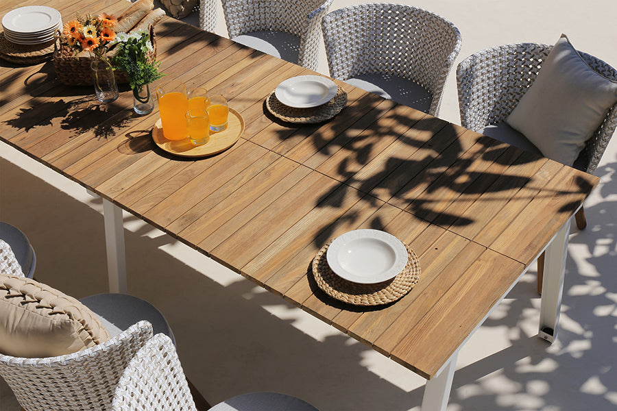 Maxximus Teak Extension Dining Table by Mamagreen, showing closeup view of maxximus teak extension dining table in live shot.