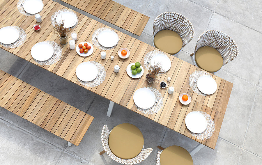 Maxximus Teak Extension Dining Table by Mamagreen, showing closeup view of maxximus teak extension dining table in live shot.