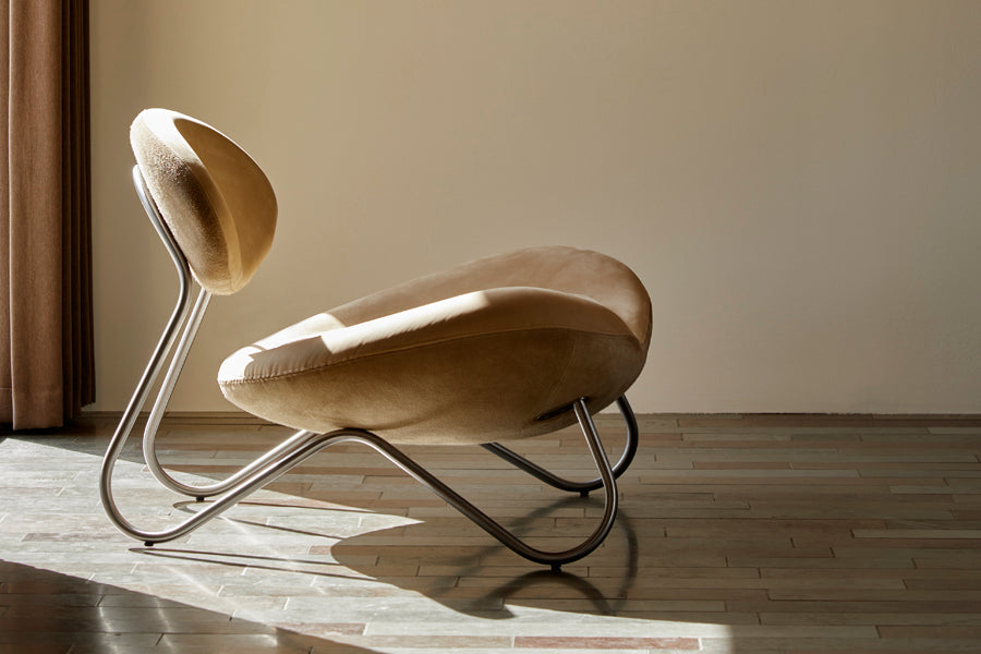 Meadow Lounge Chair by Woud, showing meadow lounge chair in live shot.