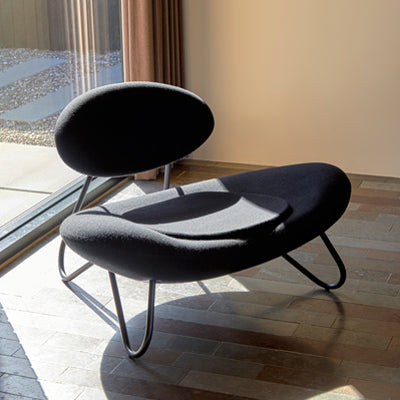 Meadow Lounge Chair by Woud, showing meadow lounge chair in live shot.