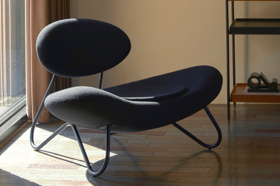 Meadow Lounge Chair by Woud, showing meadow lounge chair in live shot.