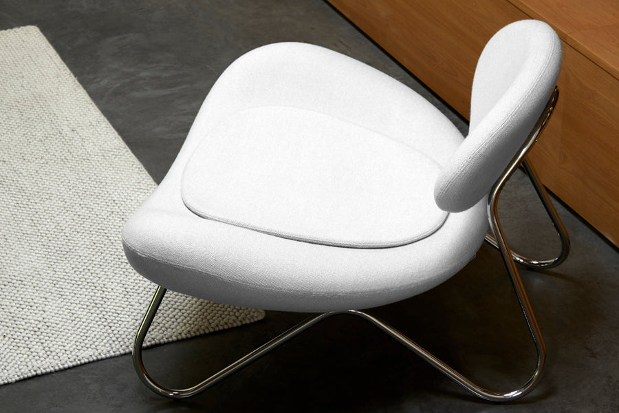 Meadow Lounge Chair by Woud, showing meadow lounge chair in live shot.