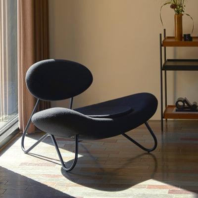 Meadow Lounge Chair by Woud, showing meadow lounge chair in live shot.