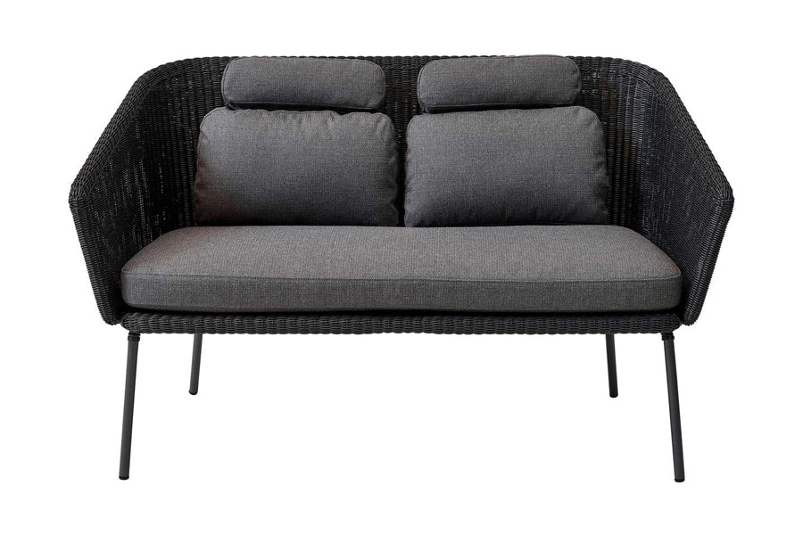 Mega Dining Bench by Cane-Line, showing front view of mega dining bench in grey weave/grey cushions.
