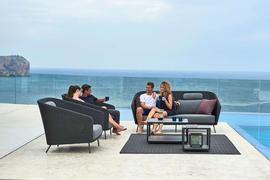 Mega Lounge Chair by Cane-Line, showing mega lounge chairs in live shot.