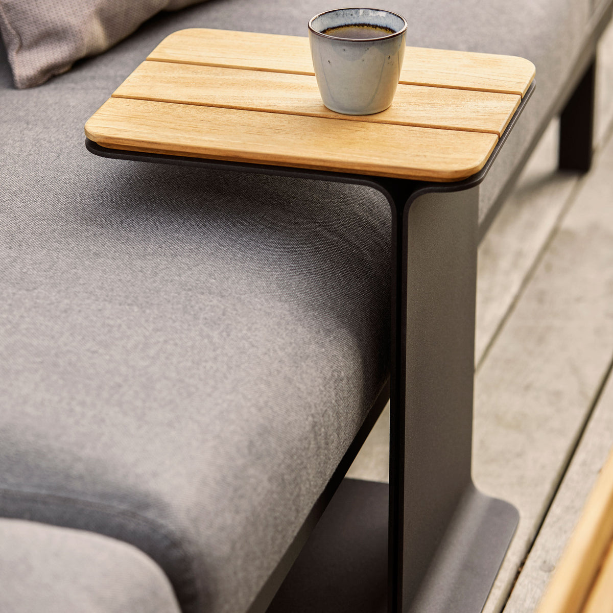 Mega Side Table by Cane-Line, showing mega side table in live shot.