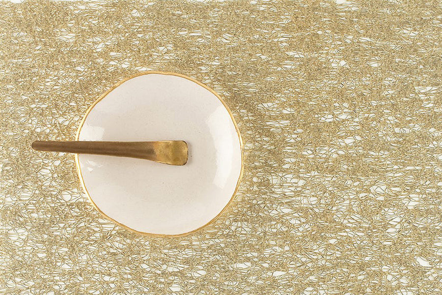 Metallic Lace Tabletop by Chilewich, showing closeup view of metallic lace tabletop in live shot.
