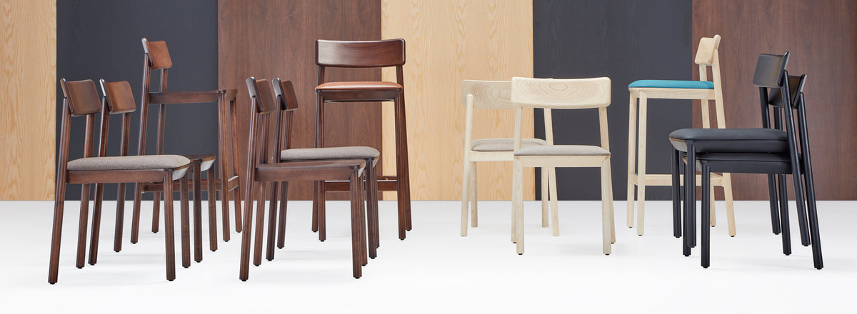 Mika Stool by B&T, showing mika stools with chairs in live shot.