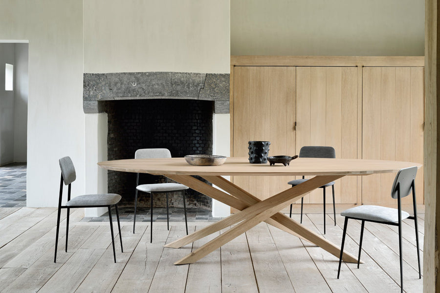 Mikado Dining Table by Ethnicraft, showing mikado oak dining table in live shot.