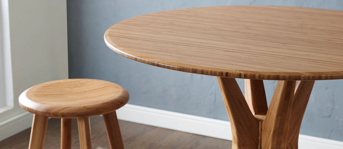 Mimosa Bar Table by Greenington, showing live shot of mimosa table in caramelized finish with stool.