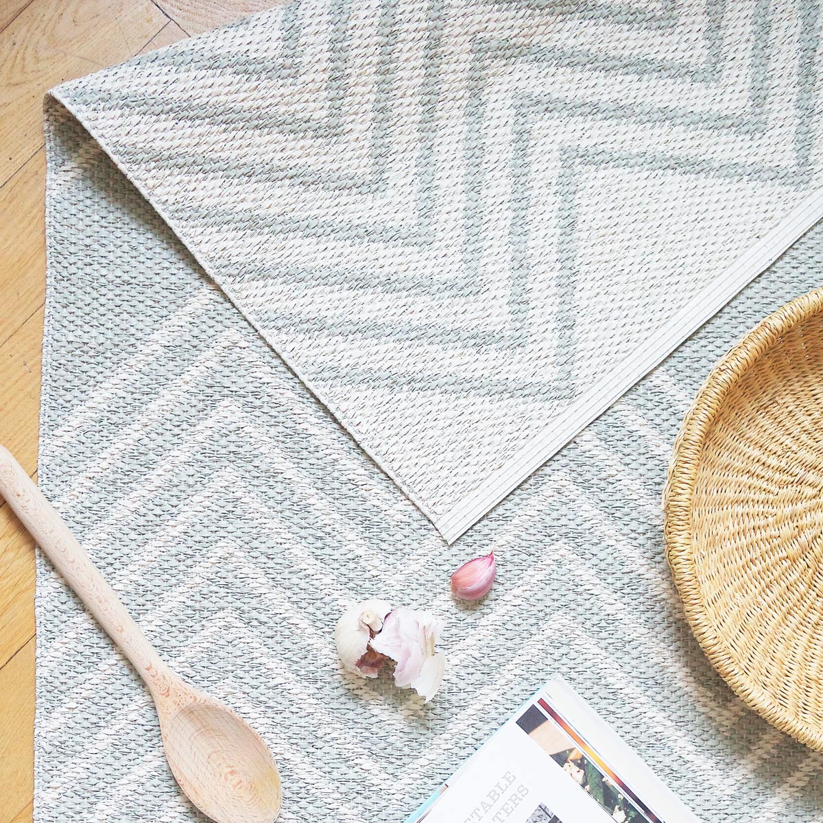 Mini Woven Plastic Rug by Brita, showing closeup view of mini woven plastic rug in live shot.