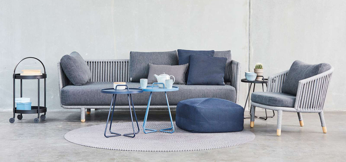 Moments Indoor Lounge Chair by Cane-Line, showing moments indoor lounge chair with sofa in live shot.
