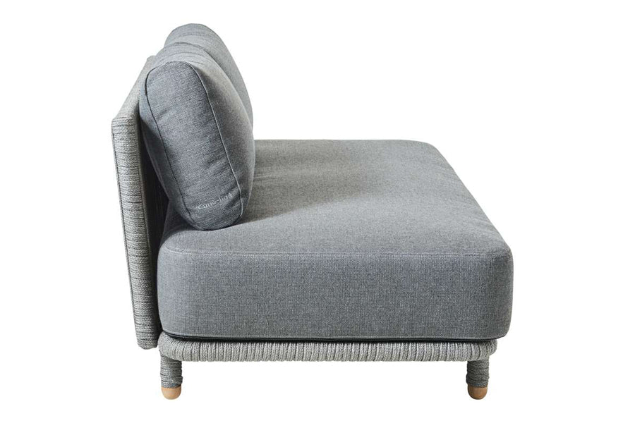 Moments Outdoor Sectional by Cane-Line, showing side view of moments outdoor sectional in grey airtouch cushion set.