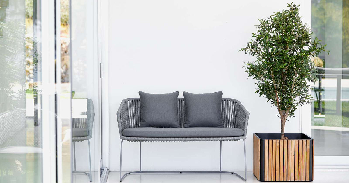 Moments Outdoor Dining Bench by Cane-Line, showing moments outdoor dining bench in live shot.