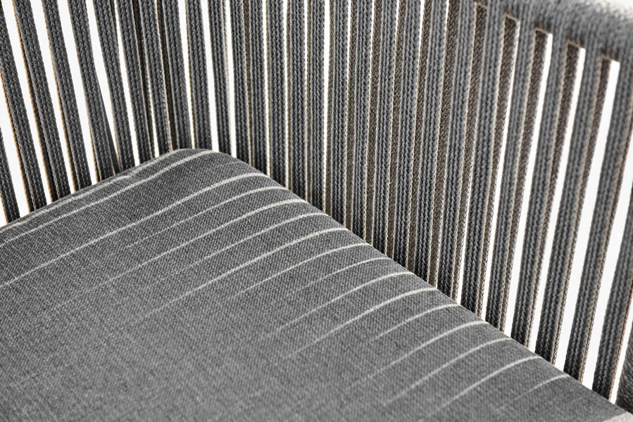 Moments Outdoor Dining Bench by Cane-Line, showing closeup view of moments outdoor dining bench in light grey soft rope/grey softTouch cushion.