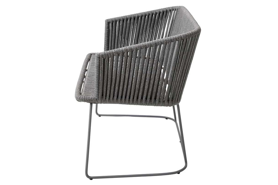 Moments Outdoor Dining Bench by Cane-Line, showing side view of moments outdoor dining bench in light grey soft rope/no cushion set.