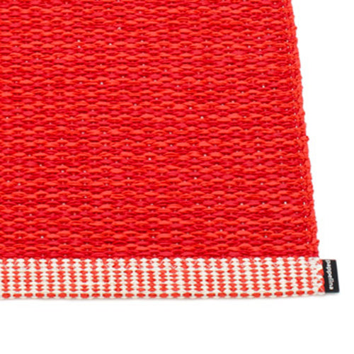 Mono Coral Red Rug by Pappelina, showing closeup view of mono coral red rug.