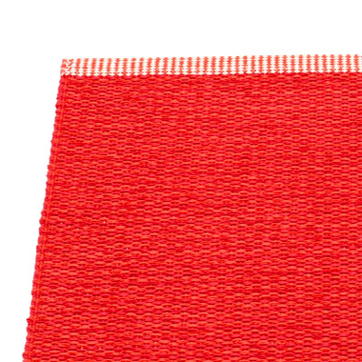 Mono Coral Red Rug by Pappelina, showing closeup view of mono coral red rug.