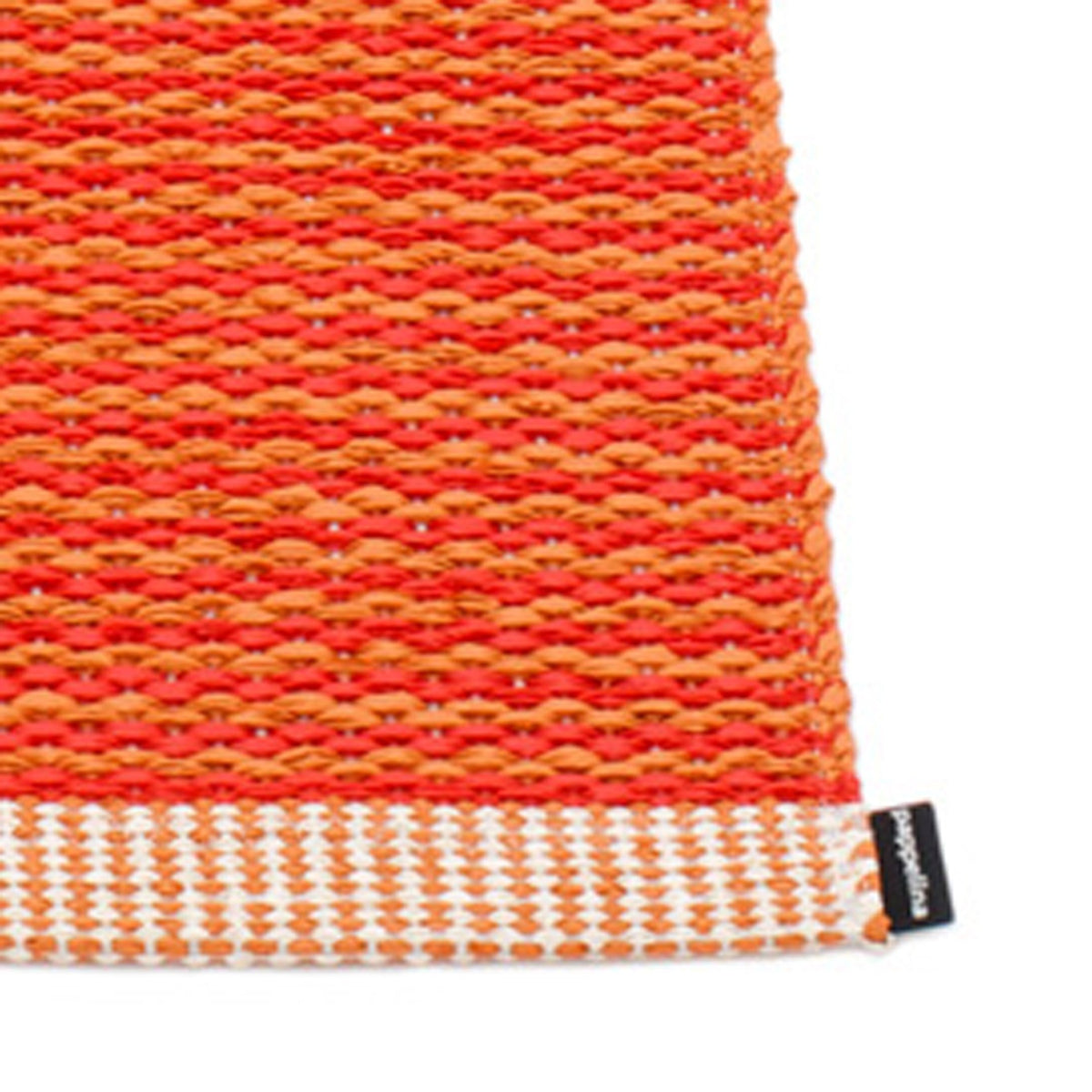 Mono Pale Orange Rug by Pappelina, showing closeup view of mono pale orange runner rug.