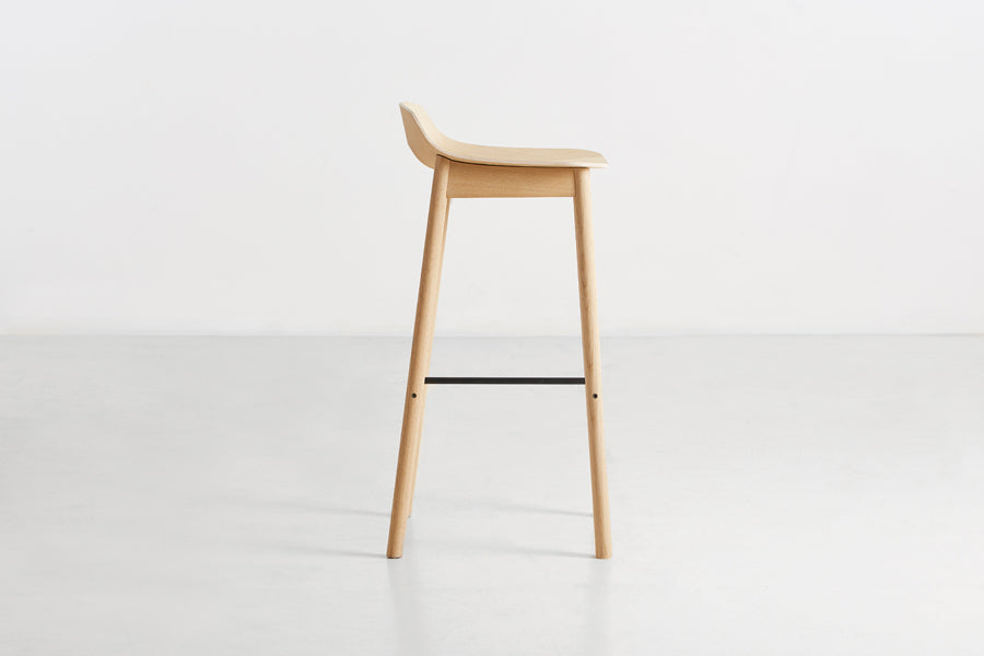Mono Stool/Chair by Woud, showing side view of mono stool/chair in studio shot.