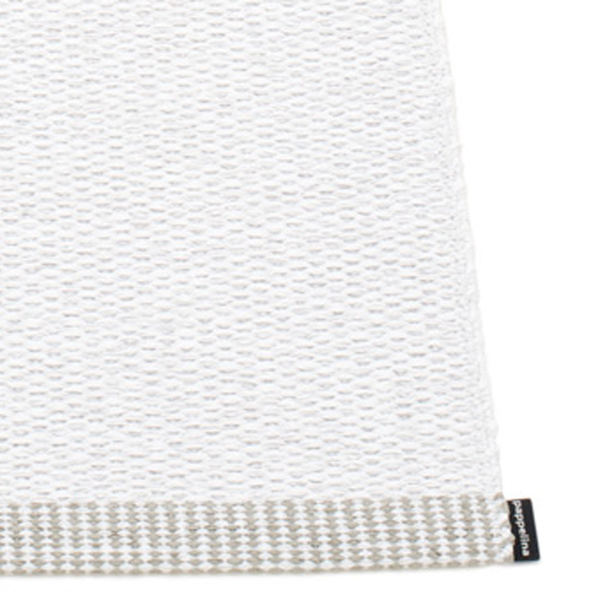 Mono White Rug by Pappelina, showing closeup view of mono white rug.
