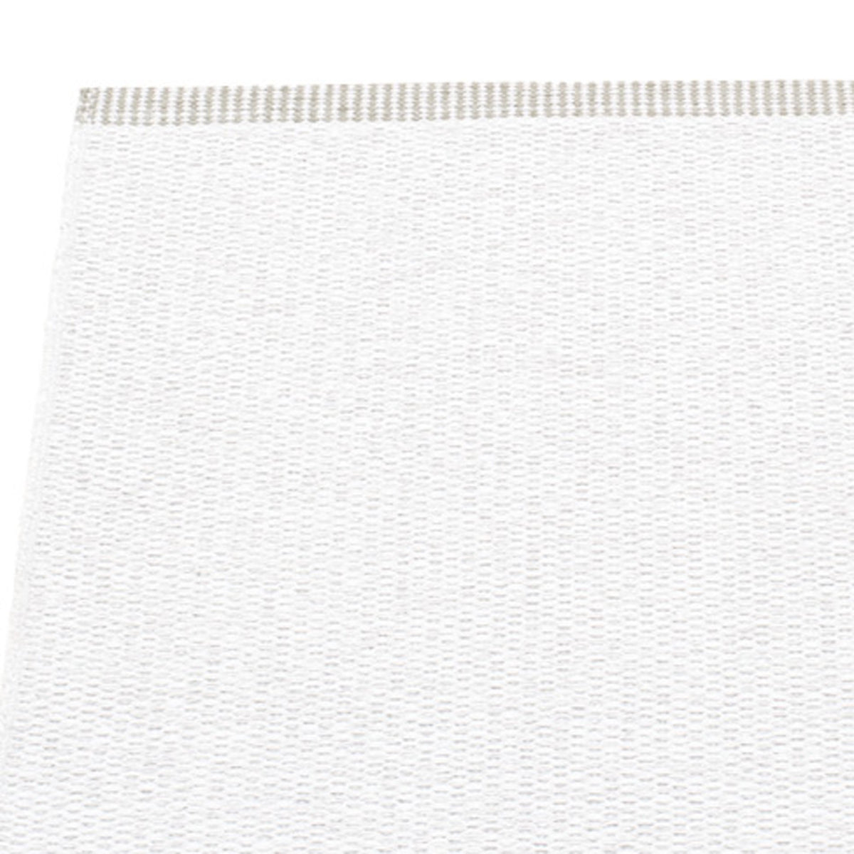 Mono White Rug by Pappelina, showing closeup view of mono white rug.