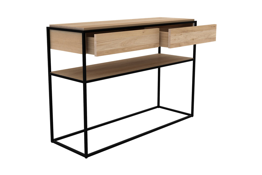 Monolit Oak Console by Ethnicraft, showing angle view of monolit oak console in oak wood/black metal.