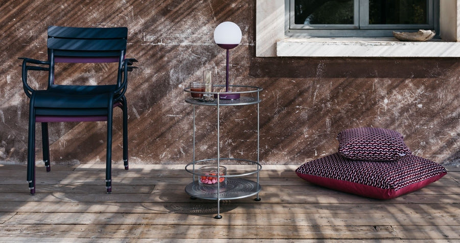 Mooon Lamps by Fermob, showing lamp, chairs, pillows & trolley in live shot.