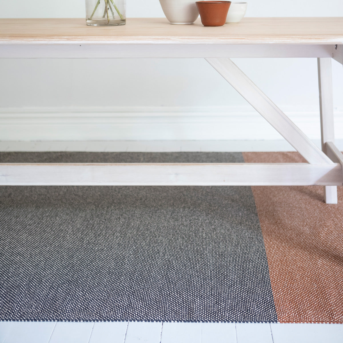 Moor Woven Plastic Rug by Brita, showing closeup view of moor woven plastic rug in live shot.