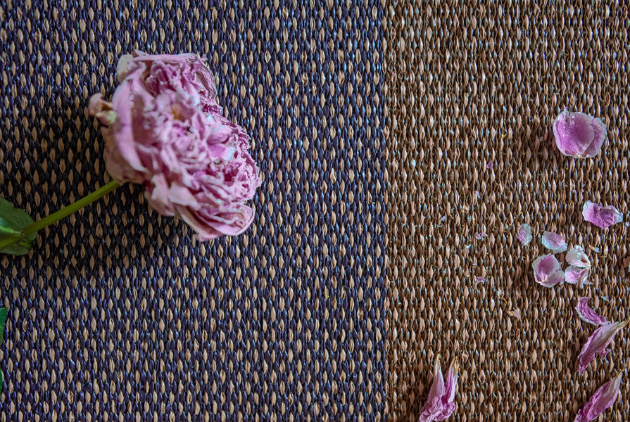 Moor Woven Plastic Rug by Brita, showing closeup view of moor woven plastic rug in live shot.