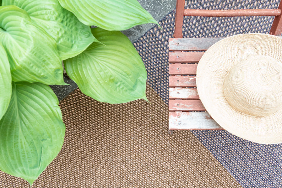 Moor Woven Plastic Rug by Brita, showing closeup view of moor woven plastic rug in live shot.